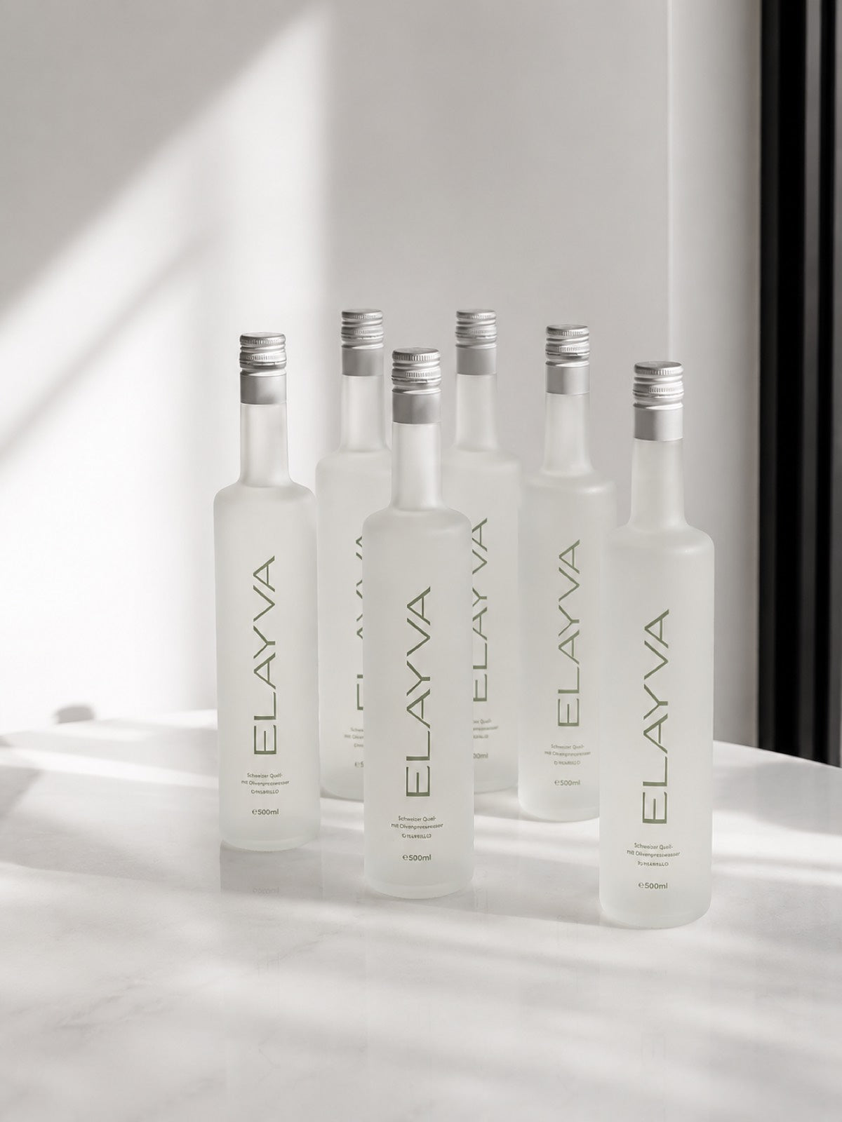 ELAYVA bottles in soft daylight