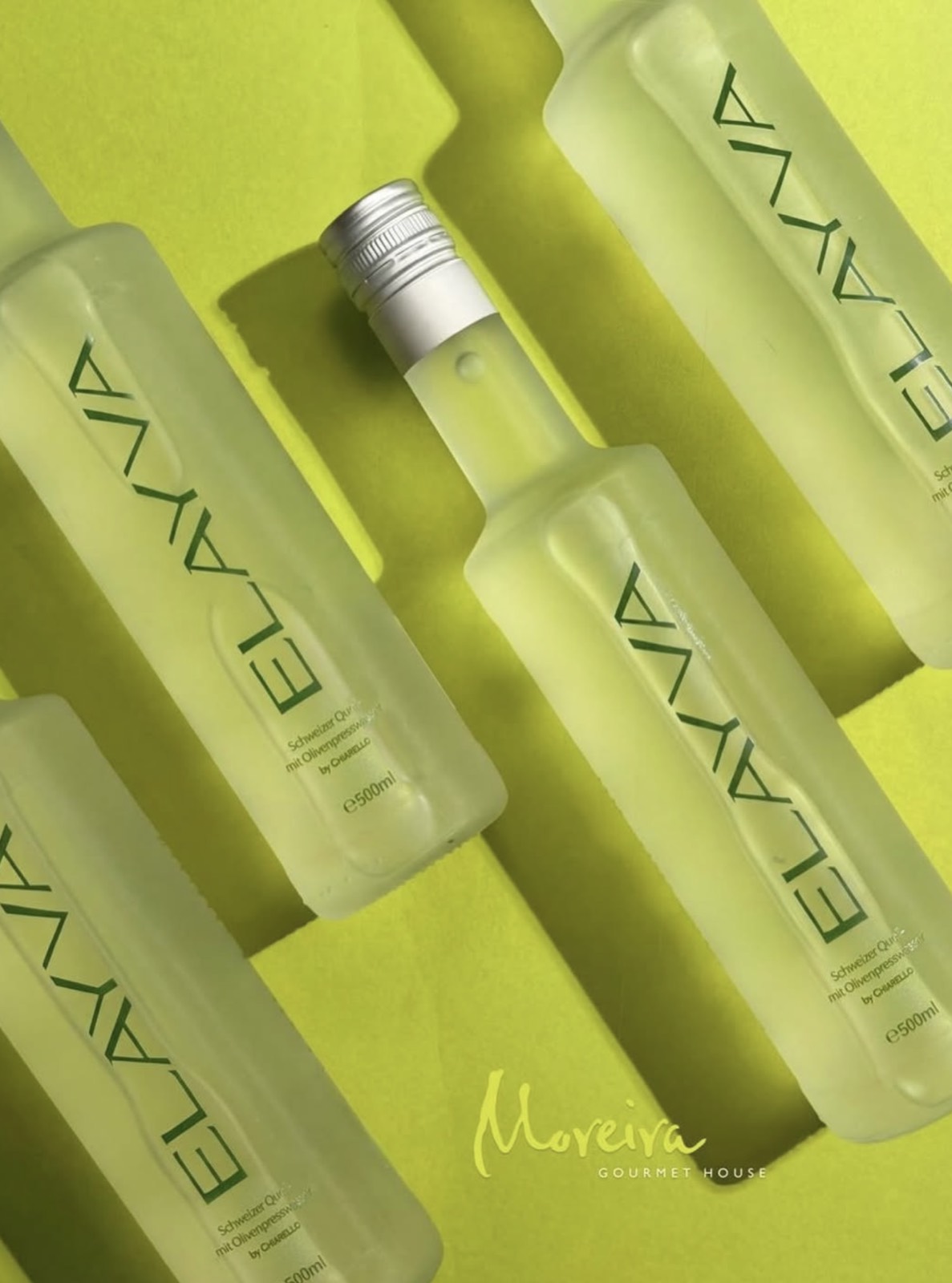 Three ELAYVA bottles on a lime green surface