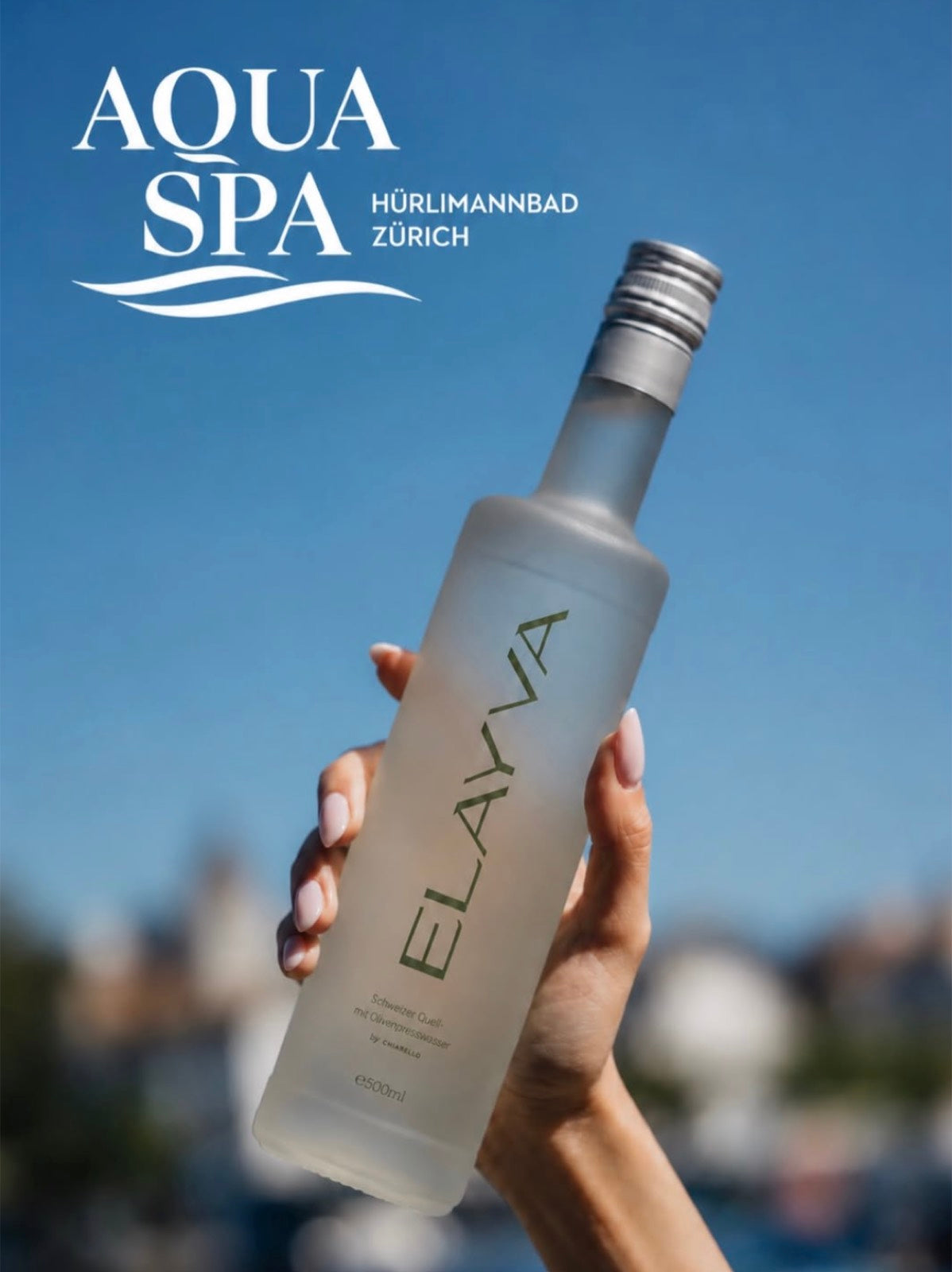 ELAYVA bottle held against a blue sky with AQUA SPA overlay